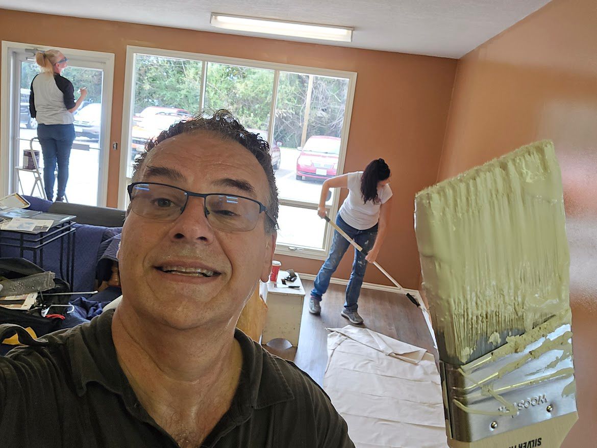Volunteers painting the church