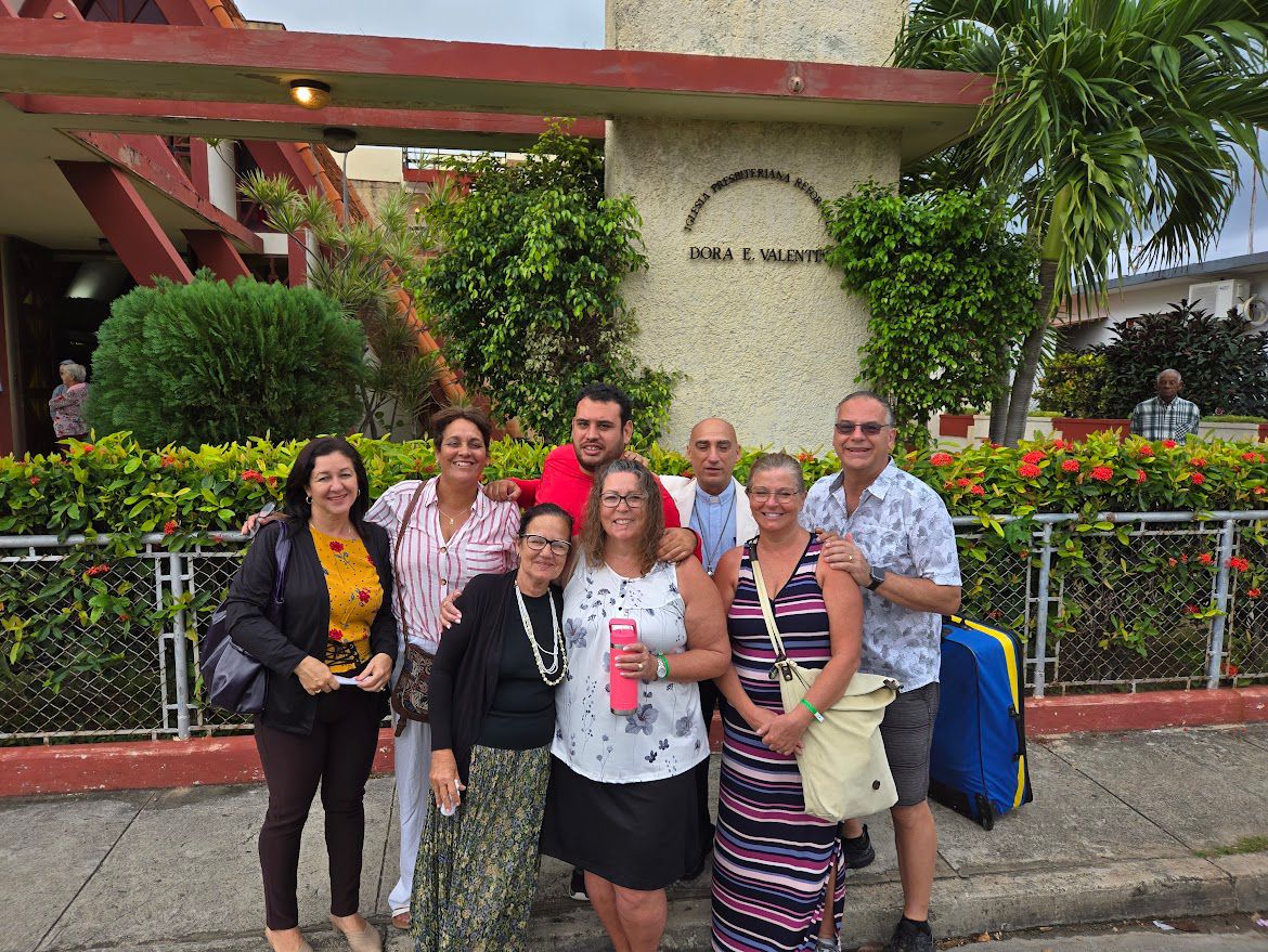 Team at the partner church gate