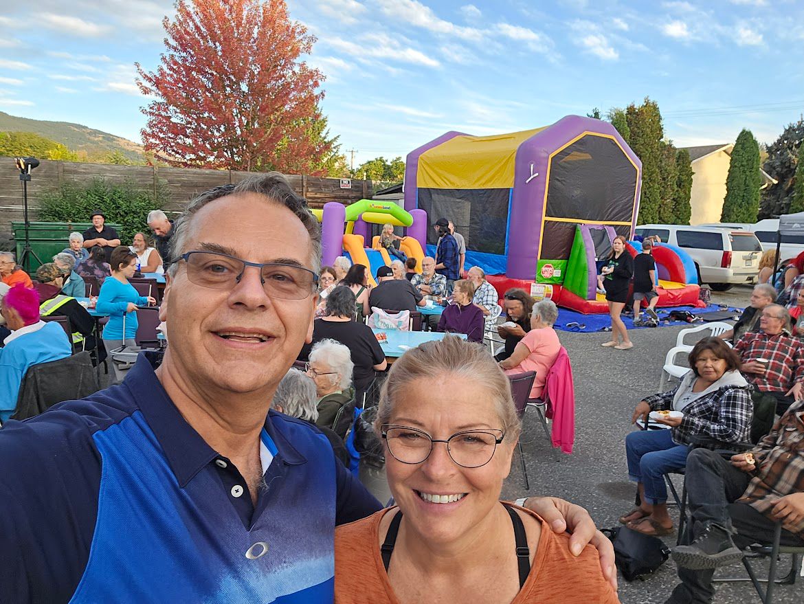 Community dinner with bouncy castle
